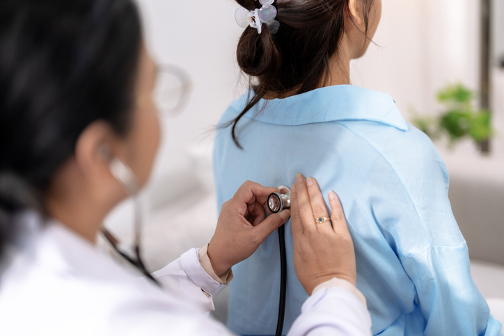 Respiratory therapist examining patient